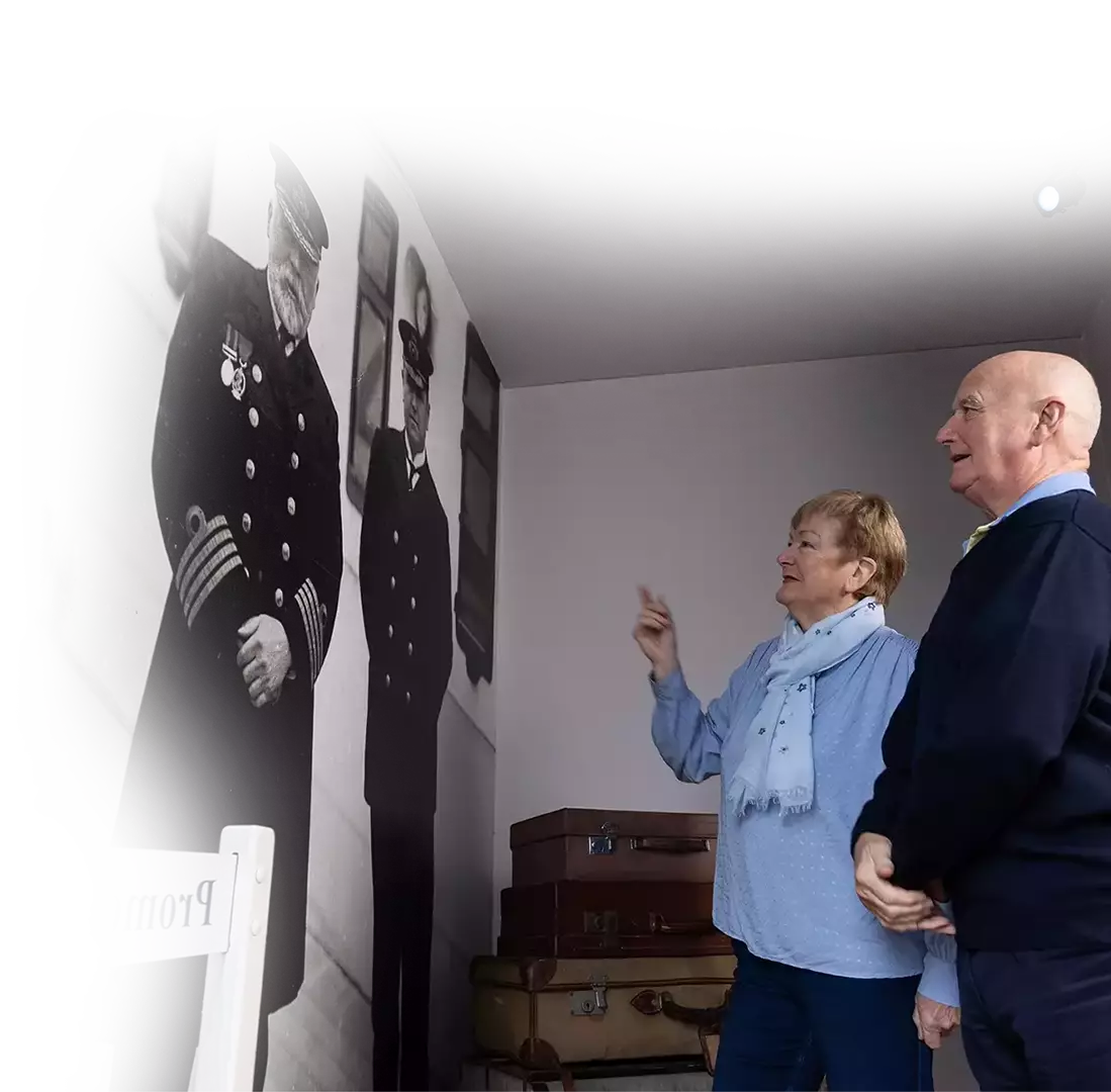 A couple looking at the Titanic Wall